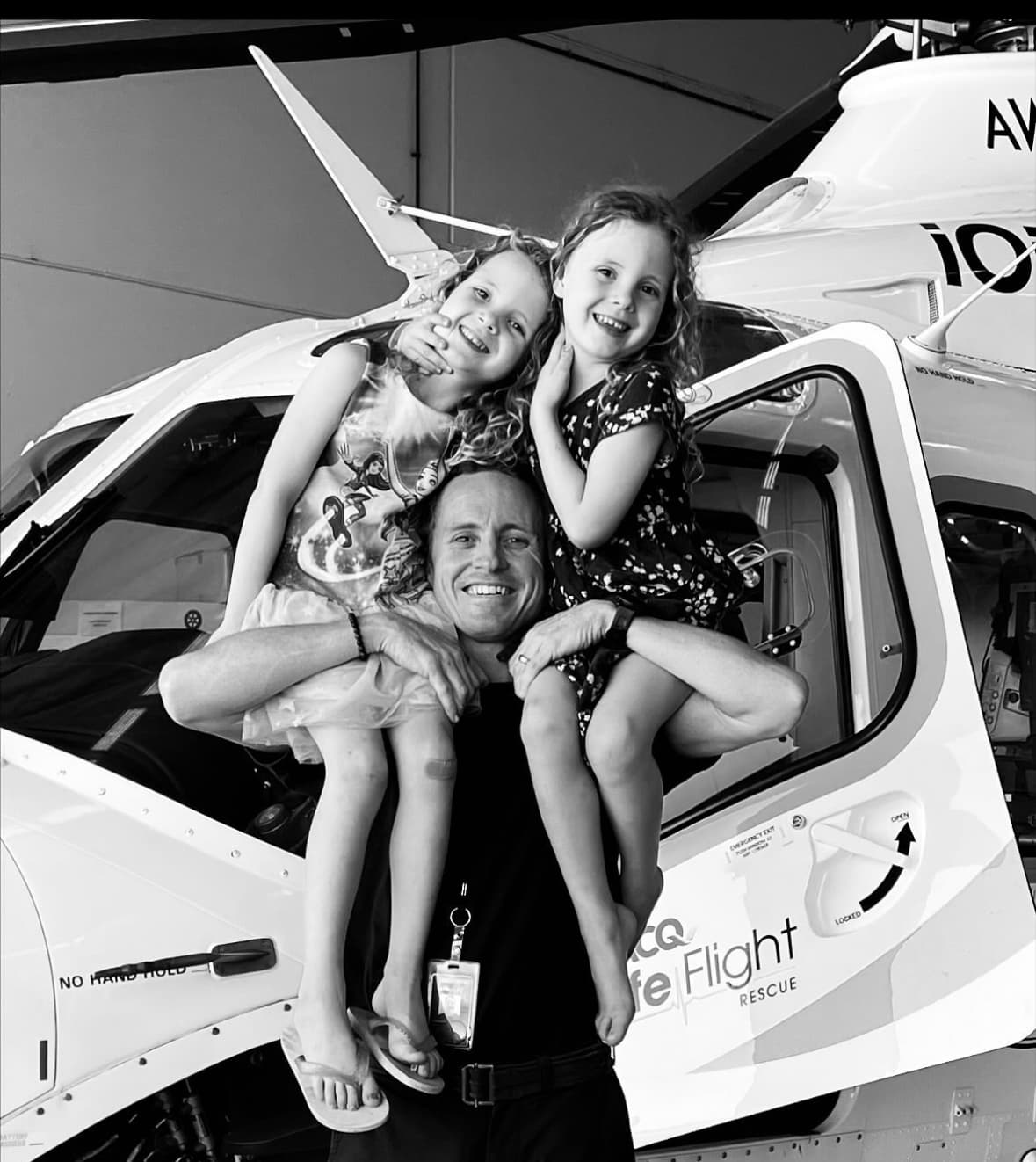 Andrew with his family at a LifeFlight Rescue helicopter